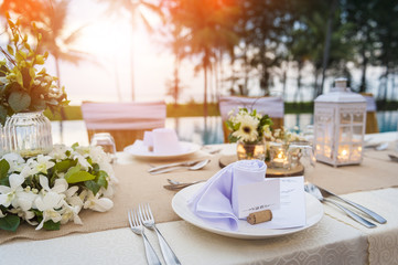 Romantic dinner setting at pool with sunset on the beach - 181741038