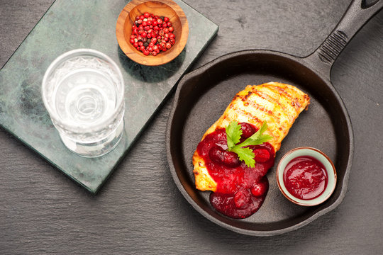Grilled chicken breast filet with curcuma spicy and cranberry sauce.