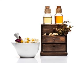 Obraz na płótnie Canvas Healing herbs and bottles of tincture, dry healthy tea, herbal medicine.