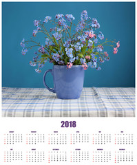 Wall calendar for 2018 with a bouquet of forget-me-nots.