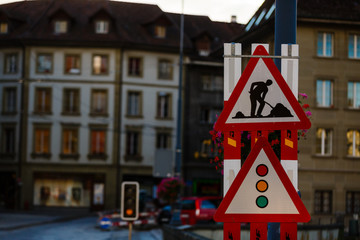Road signs on the roadside along the road warning about the repair.