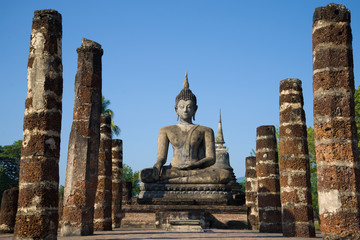 Fototapeta na wymiar Ancient Buddha's sculpture on ruins of the Buddhist temple of Wat Chana Songkram. Sukhothai, Thailand