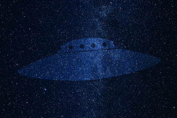 UFO silhouette on background of Universe. Unidentified flying object in the space sky.