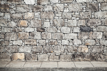 Naklejka premium Texture, gray stone wall and floor tiling