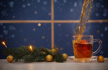 cup of tea  on background night window
