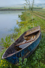 Old wooden boat beached. Photo.