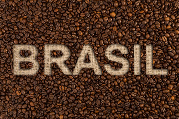 Obraz na płótnie Canvas Brasil coffee concept text on roasted beans