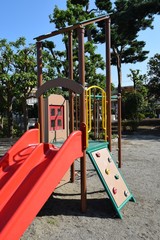 Playground equipment in the park,  slide and bouldering for children