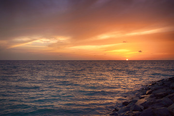 Sunset in the Maldives. Beautiful colorful sunset over the ocean at Maafushi island,Maldives