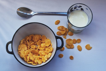 cornflakes, kefir and apples - a healthy breakfast.
