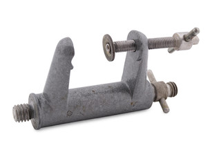 Old metal clamp on a white background