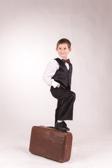 A boy posing in studio over grey background 