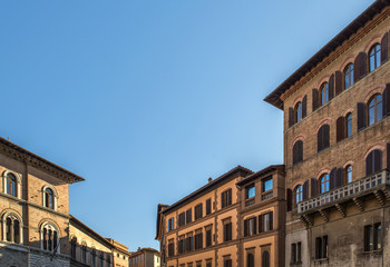 Fototapeta na wymiar windows and balconies view of a italian street in siena