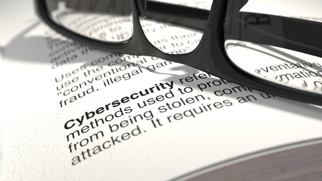 The definition of cybersecurity from a dictionary closeup