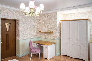 working area in room, next to  door and  classic wardrobe in delicate purple colors