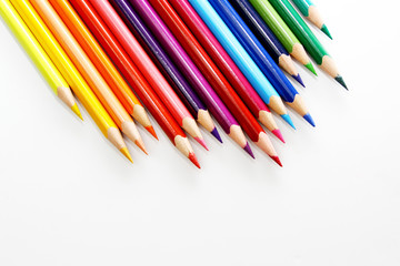 Fototapeta premium Colored pencil as wallpaper / A colored pencil is an art medium constructed of a narrow, pigmented core encased in a wooden cylindrical case.