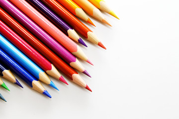 Colored pencil as wallpaper / A colored pencil is an art medium constructed of a narrow, pigmented core encased in a wooden cylindrical case.