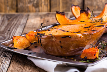 Roasted pumpkin with thyme and balsamic glaze on top