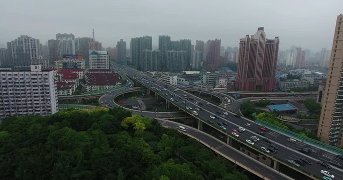 SHANGHAI, CHINA – JUNE 2016 : Aerial shot over Central Shanghai highway roundabout traffic at daytime