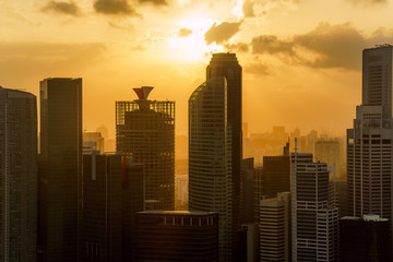 Singapore city skyline at sunset conctruction and modern architecture