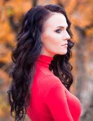 Fototapeta premium Pretty brunette in an autumn forest