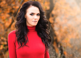Fototapeta premium Pretty brunette in an autumn forest
