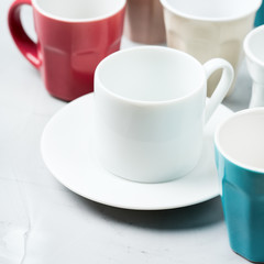 Different empty tea and coffee mugs and cups for breakfast