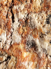 Ultra Closeup of the surface of a reddish freckled stone