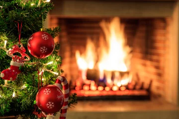 Foto auf Acrylglas Christmas tree on burning fireplace background © Rawf8