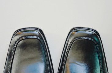 black business leather shoe on tile floor