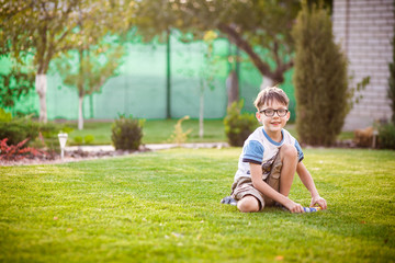 Portrait of cute young boy in park