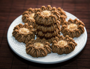 stack of cookies in a plate on a table close up