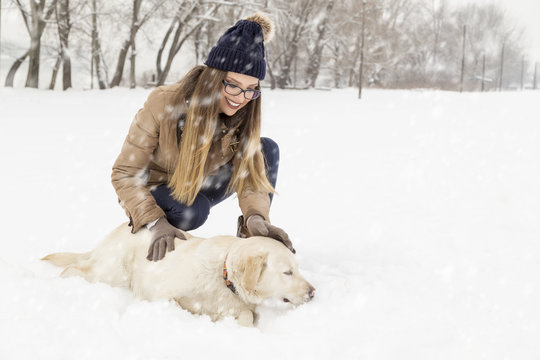 Cuddling the dog in the snow