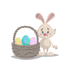 Cartoon cute smiling easter bunny with big basket and painted colorful eggs. Spring character mascot and seasonal vector illustration.