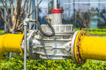 The gas gate, yellow valve and yellow pipes.