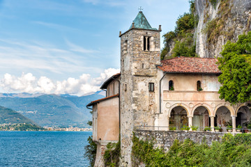 Fototapeta na wymiar Hermitage of Santa Caterina del Sasso, is rock face directly overhanging the lake Maggiore, Leggiuno, Italy