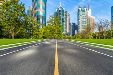 city road through modern buildings in shanghai