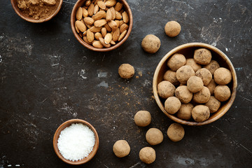 Raw candies from dates, cocoa, coconut and nuts. Vegetarian food. The concept of a healthy diet
