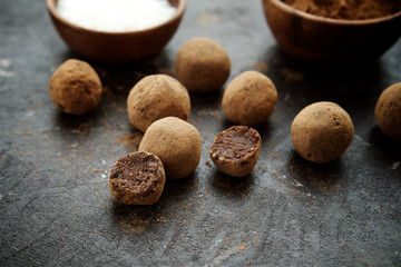 Raw candies from dates, cocoa, coconut and nuts. Vegetarian food. The concept of a healthy diet
