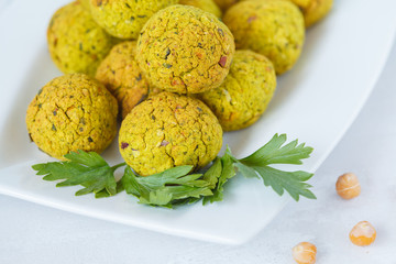 Fresh baked falafel with parsley. Vegan dietary healthy food concept.