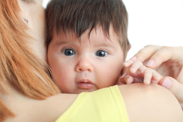 portrait of a newborn baby in mother's shoulder