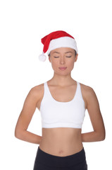 Obraz premium Asian woman in Santa Claus costume is engaged in fitness