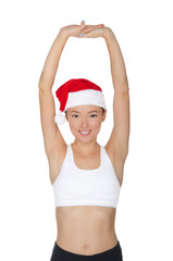asian woman in Santa's hat engaged in fitness