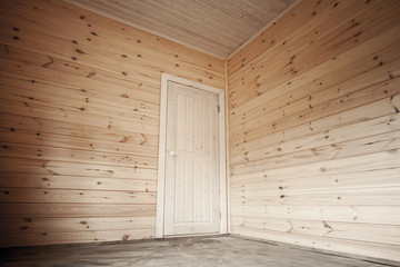 Obraz na płótnie Canvas White door in empty room, wooden interior