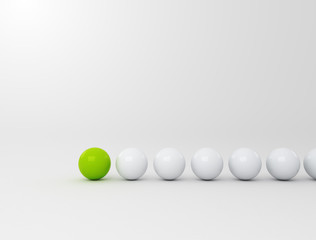 Row of white balls with green leader. Business strategy concept 