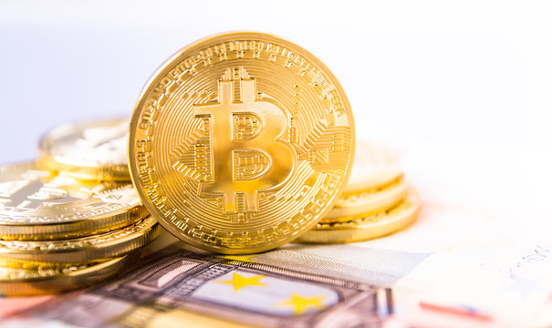 bitcoins over euro bill with big copyspace
