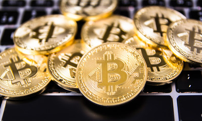 golden bitcoins over keyboard