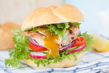 Homemade burger with grilled chicken and curry sauce.