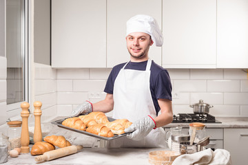 baker showing croissant