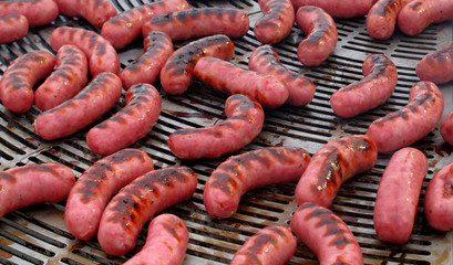 Sausages cooking on a barbecue